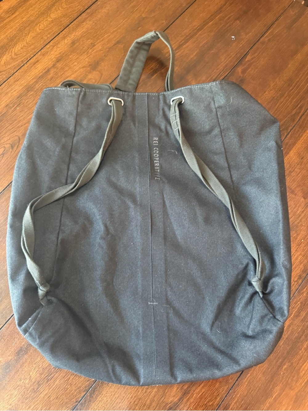 REÍ Cooperative Black Canvas Drawstring Tote Backpack